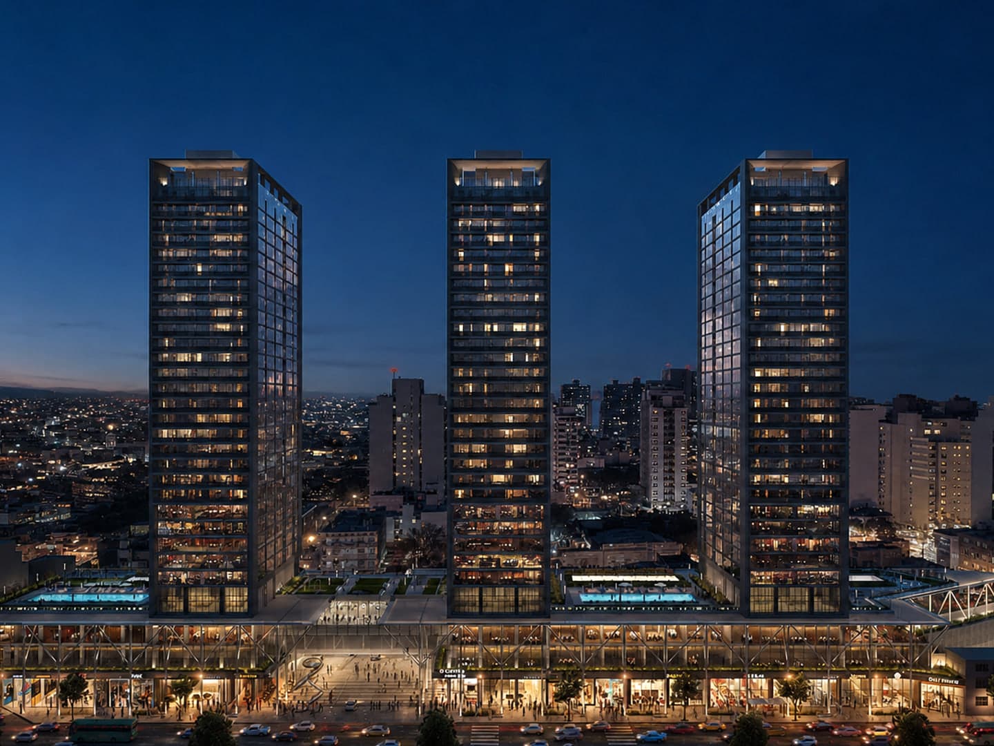 Visualización nocturna de las tres torres y el paseo comercial de POCITO Social Life con actividad urbana.